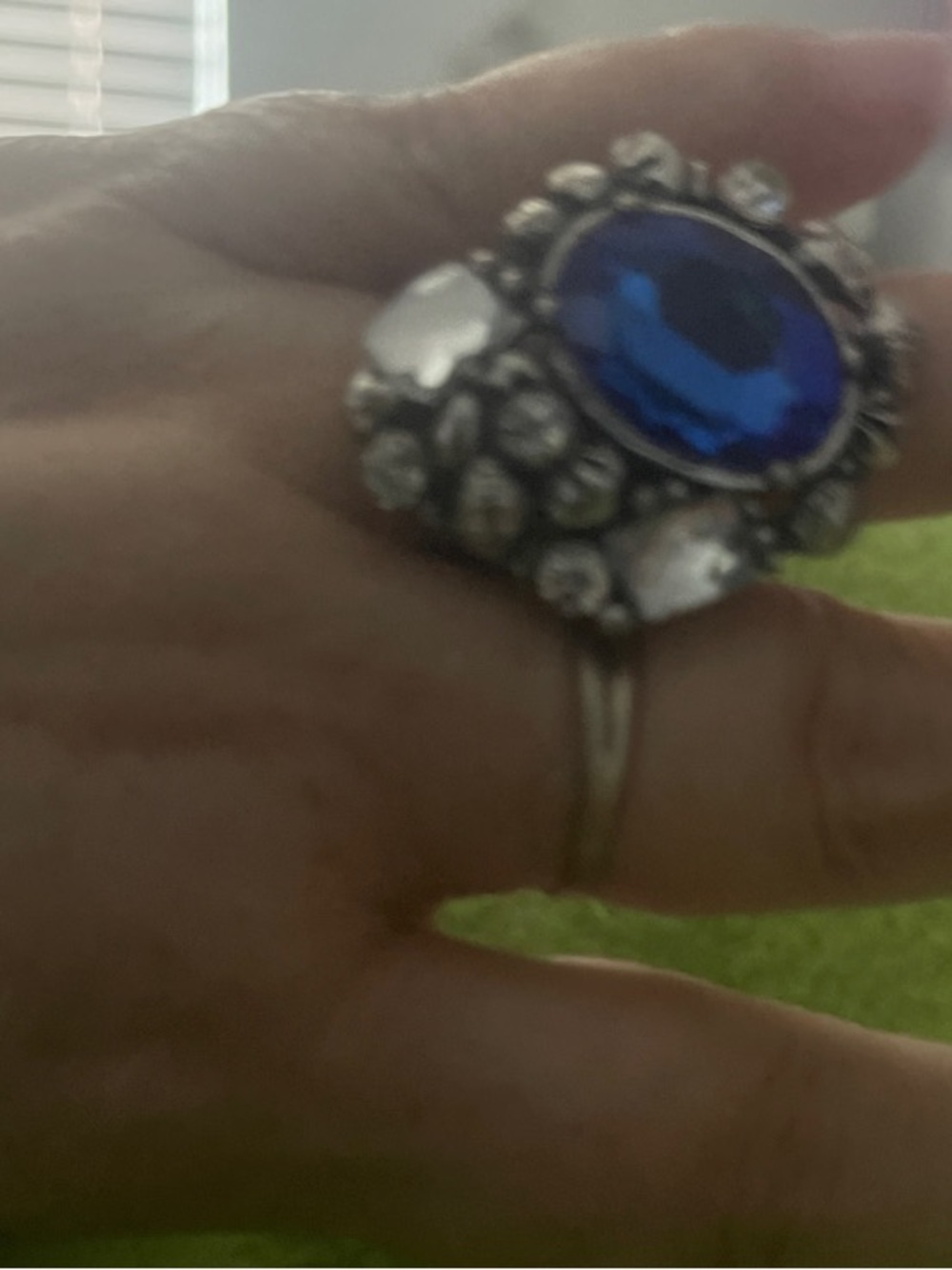 Silver-Tone Floral Statement Ring with Blue Oval .